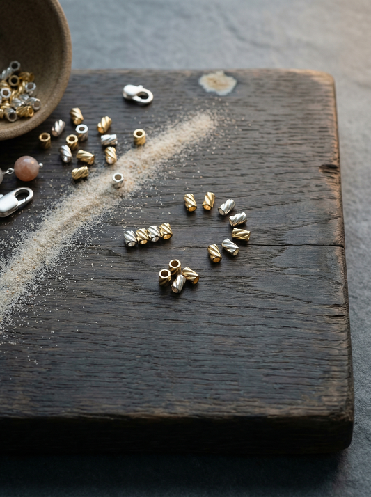Silver and gold 2x2 twist crimps on weathered oak with ceramic bowl and clasp